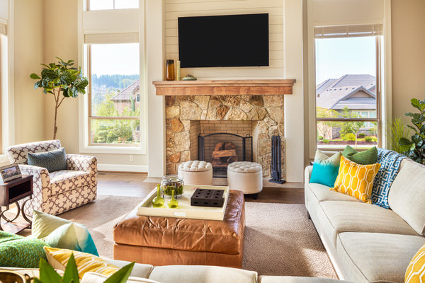 A couple reviewing a home purchase offer with their REALTOR in a Montgomery County, PA living room
